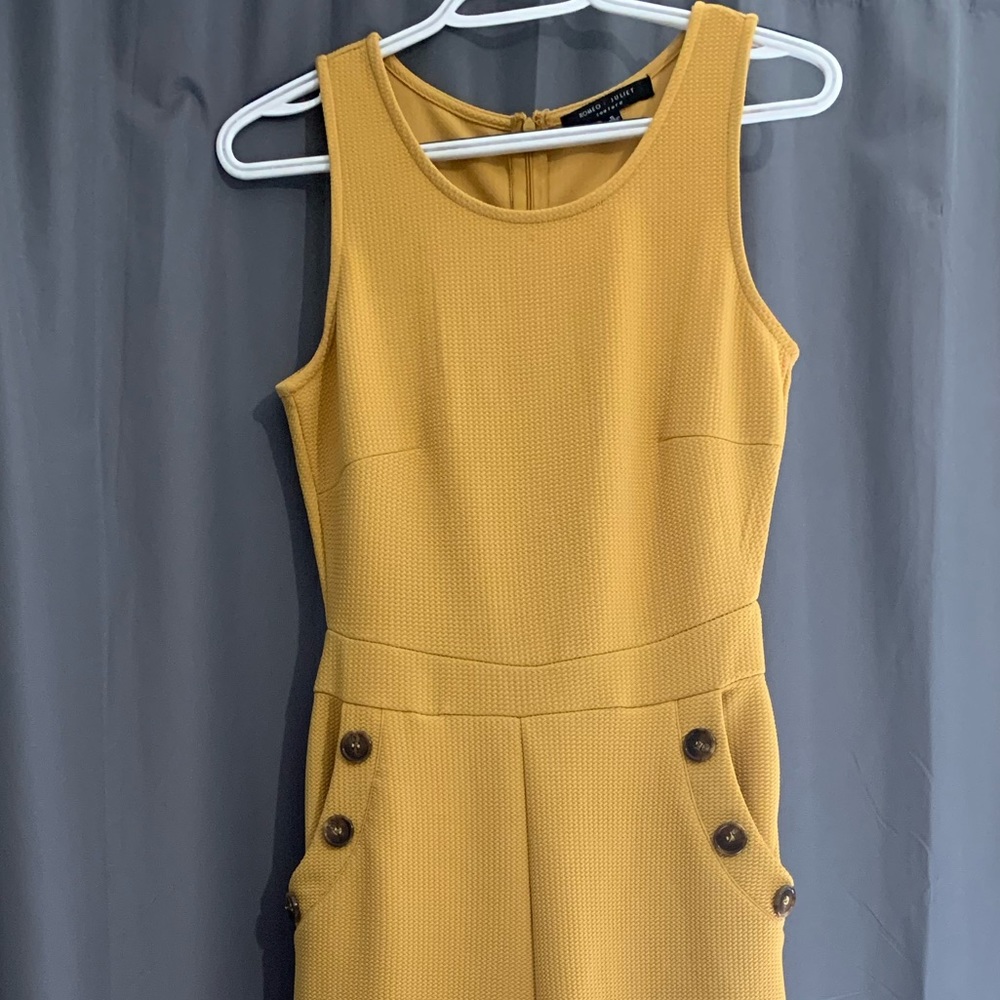 Used womens Romeo & Juliet Couture jumpsuit size S Yellow